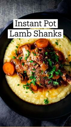 a black bowl filled with mashed potatoes and meat