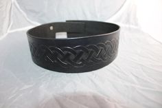 Introducing our hand-tooled headband Crown, made with the highest quality leather. This regal accessory is the perfect addition to any armor set, adding an air of royalty to your warrior ensemble. Each headband Crown is crafted with precision and care, ensuring that you receive a product that is both durable and visually stunning. Whether you're headed into battle or simply attending a renaissance fair, this headband Crown is sure to turn heads. Upgrade your armor game today with our hand-tooled headband Crown. One size Fits Most 18 - 24 inch diameter Black Adjustable Gothic Belt, Traditional Black Adjustable Belts, Festival Crown, Fantasy Crown, Leather Headband, Headband Crown, Crown Black, Leather Headbands, Crown Headband