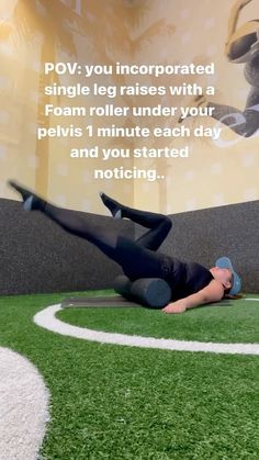 a man laying on top of a lush green field next to a soccer field with the words pov you incorporated single leg raises with a foam roller under your pel's 1 minute each day and