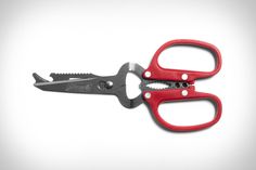 two pairs of scissors with red handles on white background, one opened and the other closed