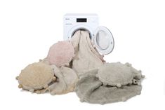 several different types of stuffed animals next to a dryer and washing machine on a white background