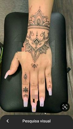 a woman's hand with tattoos on it