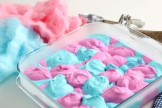 a blue and pink dessert in a glass dish