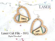 laser cut wooden earrings with the words laser cut file - svg on them and an image