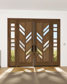 two wooden doors with glass inserts in the center and side panels on each door