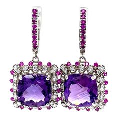 This is part of Chairish’s Fine Jewelry assortment.  Amethyst, Pink Sapphire and Diamond Drop Earrings!   These stunning Earrings have 2 large Cushion Cut Amethysts that weigh 12.16 Carats  The Cushion cut Amethysts are embellished with alternating 32 Round Cut Diamonds that weigh 0.52 Carats (clarity: SI1, Color: F) and 48 Pink Sapphires that weigh 1.01 Carats. The Total Carat weight of the Earrings are 13.69 Carats.  The Earrings are about 1.50 inch in length. They are beautifully set in 14 Ka White Gold Drop Earrings, Art Deco Earrings, Diamond Drops, Antique Earrings, Stunning Earrings, Diamond Drop Earrings, Gold Drop Earrings, Pearl Drop Earrings, Cushion Cut