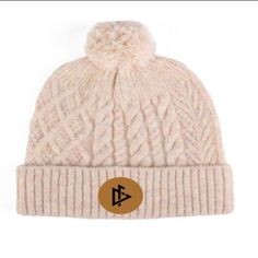 Made with soft and breathable cotton fabric, this beanie provides ultimate comfort and warmth for those chilly days. The beanie features a beautifully stitched DeemedFit logo centered on the front, adding a touch of elegance and sophistication to your outfit. Whether you're heading out for a casual day out or hitting the slopes, this beanie is the perfect addition to complete your look. Its versatile design and neutral color make it easy to pair with any outfit. Stay fashionable and comfortable. Adjustable Cotton Beanie For Winter, Warm Cotton Beanie Bonnet, Winter Cotton Bonnet Cap, Cotton Winter Bonnet, Warm Cotton Beanie Hat, Comfortable Adjustable Beanie For Winter, Adjustable Cotton Hats For Winter, Comfortable Adjustable Winter Beanie, Adjustable Cotton Winter Hat