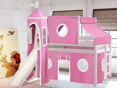 a child's pink and brown castle bed with slide