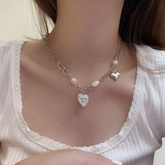 Material: Alloy Color: White K Fashion Element: Love Heart/Heart Shape Style: Personality Valentine's Day Alloy Chain Jewelry, Heart-shaped Alloy Chain Necklace, Heart-shaped Alloy Necklaces For Mother's Day, Silver Heart Necklace With Chain For Mother's Day, Mother's Day Silver Heart Necklace With Chain, Mother's Day Silver Heart Necklace, White Clavicle Chain Necklace For Valentine's Day, Alloy Heart Pendant Jewelry With Chain, Heart Shaped Silver Alloy Charm Necklace