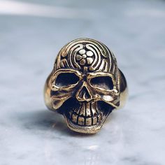 Skulls ring with detailed features and a rugged finish. Comes in Silver and Brass. 100% Handmade in Bali, Indonesia 100% Original Design Free Re-sizing & Exchanges Free Worldwide Shipping Please use the Sizing chart image found on all product pages or the Sizing Page to find your exact ring size before ordering. All sizing is in USA sizes. ﻿Brass jewelry is a safe mixed metal with many mineral health benefits. Please note that for some people, their PH levels can cause slight coloration which is Acetic Acid, Ringe Gold, Skull Jewelry, Large Ring, Skull Ring, Brass Jewelry, Copper Plated, Ring Collections, Brass Metal