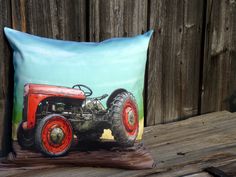 a pillow with an old tractor painted on it