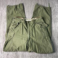 Vintage 50s US Army Military Field M 1951 Multiple Pocket Basic Essential Green Cargo Trouser Pants 34 Waist Mens Condition:  Excellent Used Condition  = No Flaws Measurements: Please see photos above for all measurements IF YOU BUY TWO OR MORE ITEMS USE THE CODE BUNDLE @ CHECK TO SAVE 20% WE SHIP WITHIN 24 HOURS AFTER PURCHASE! Please be aware that we do not offer free returns!! The Buyer is responsible for the cost of the return label. Follow us on TikTok & Instagram @findsnostalgic and tag us Vintage Cargo Pants With Cargo Pockets For Outdoor, Vintage Green Cargo Pants With Pockets, Retro Full-length Cargo Pants With Pockets, Retro Full Length Cargo Pants With Pockets, Vintage Outdoor Bottoms With Cargo Pockets, Vintage Khaki Pants With Side Pockets, Retro Khaki Bottoms With Pockets, Vintage Khaki Full-length Cargo Pants, Vintage Full-length Khaki Cargo Pants