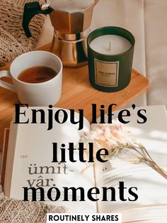 an open book sitting on top of a table next to a cup of coffee