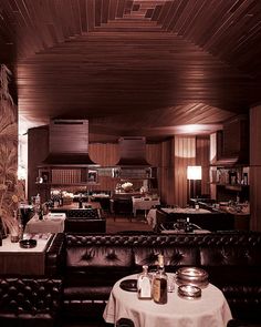 a restaurant with leather couches and tables