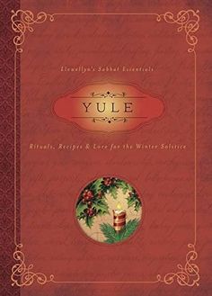 the front cover of yule, with an image of a candle and holly wreath