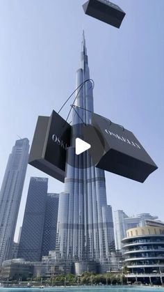 an advertisement for chandelier in front of the burj tower, dubai