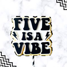 a cake topper with the words five is a vibe on it in black and gold