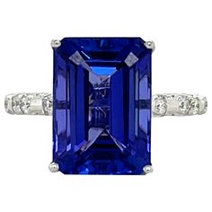 This stunning ring has a royal blue emerald cut AAA quality Tanzanite with top quality brilliant cut round diamonds on the shank and basket and is set in 18K white gold. It comes in a beautiful box ready for the perfect gift! Size 6.5...Can be resized 18KW: 3.95 gms Tanz wt: 8.71 cts Tanz stones: 1 emerald cut, 13.3 x 9.5 mm Diamond: 76 brilliant cut round, 0.54 cts, Color: H/I, Clarity: SI Usually ships within 1-2 business days Retail value: $16,650 Blue Emerald, Platinum Diamond Rings, Tanzanite Diamond, Shiny Things, Platinum Ring, White Gold Rings, Emerald Cut, Blue Sapphire, Fashion Rings