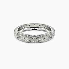 an antique style wedding band with round diamonds on the inside and outside, set in white gold