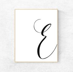 a black and white print with the letter e in cursive writing on it