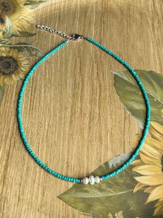 Elegant yet simple turquoise seed bead choker necklace with three fresh water pearls in the middle hugged by a silver hematite spacer bead. Made of tiny turquoise colored glass seed beads and fresh water potato pearls. I also carry this in black, see pictures. Lobster claw closure with 2" extension. I individually strung each bead and will make it to your desired length. Please note:  this also comes as a bracelet or anklet, choose size 6 - 10.5 for the bracelet or anklet. Choker necklace comes Handmade Turquoise Necklace For Summer, Turquoise Choker With Round Beads For Summer, Handmade Turquoise Necklace As Summer Gift, Turquoise Jewelry With Spacer Beads For Summer, Dainty Beaded Turquoise Necklace, Adjustable Turquoise Pearl Necklace With Round Beads, Handmade Dainty Pearl Necklace For Summer, Dainty Adjustable Pearl Necklace For Summer, Seed Bead Choker