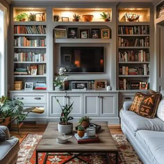 a living room filled with lots of furniture and bookshelves covered in bookcases