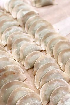 some dumplings are lined up on a table