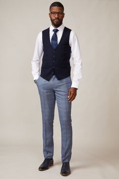 A formalwear staple, this Kelvin waistcoat epitomises versatility. In a classic navy, it is made for mix-and-match looks and breaks up patterns beautifully with its subtle textured fabric. The bespoke MD print lining adds elegance and with adjuster buckles to the each side you'll have the ability to create a perfectly contoured shape. Also available in a double-breasted option. Model wears size 38R. Features Slim fit Single-breasted 5 button fastening Complimentary pocket square Buckle adjuster English Gentleman, Men's Waistcoat, 3 Piece Suits, Textured Fabric, The English, Mix N Match, Pocket Square, Formal Wear, Single Breasted