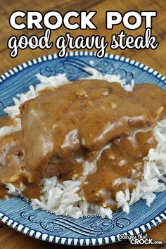 crock pot good gravy steak on top of white rice in a blue and white plate