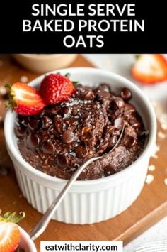 a white bowl filled with chocolate cake and topped with strawberries on the side text reads single serve baked protein oats