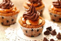 cupcakes with chocolate chips and caramel drizzled on the top