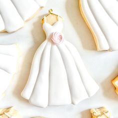 some cookies are shaped like wedding gowns