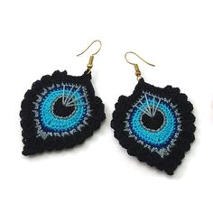 two pairs of earrings with crochet designs on them, one is blue and the other is black