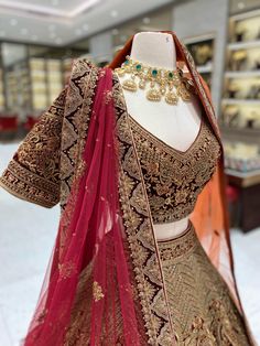 Feel like royalty on your special day with our Burgundy Gold Bridal Lehenga. The rich burgundy color is complemented by intricate gold bead work on the velvet blouse. The velvet border adds a touch of elegance to this beautiful lehenga. Stand out and make a statement with this luxurious piece. Fabric: Net with Raw Silk lining! WASH CARE INSTRUCTIONS - Please Dry clean only when it is applicable! Ready to Ship! Red Heavy Lehenga For Festive Occasions, Red Embellished Lehenga For Festive Occasions, Red Embellished Bollywood Lehenga, Gold Traditional Lehenga For Ceremonies, Heavy Red Dupatta With Traditional Drape, Heavy Red Lehenga For Reception, Heavy Red Bollywood Lehenga, Gold Anarkali Choli For Traditional Ceremonies, Heavy Red Lehenga For Diwali