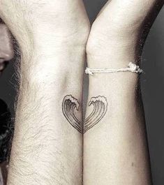 two people with matching tattoos on their arms