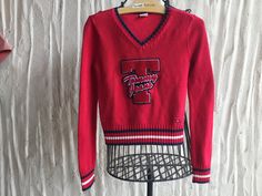 Collectible Tommy Hilfiger sweater from the 90s Size Petite Small 100 percent cotton   Huge Chenille Patch Applique Striped ribbing Traditional Red, White, Blue   Measurements taken laid flat side to side: (so double) Shoulder to Shoulder seam:  15 inches Under arm to under arm: 15 inches Waist 14 inches Length from neckline to hemline is 20 inches Sleeve measures 24.5 from shoulder to wrist 90s Style Sweater For College In Winter, 90s Style Cotton Sweater, 90s Style Winter Sweater For College, 90s Style Long Sleeve Cotton Sweater, 90s Style College Sweater For Winter, 90s Style Cotton Sweater For Fall, Tommy Hilfiger V Neck Sweater, Patch Applique, Chenille Patch