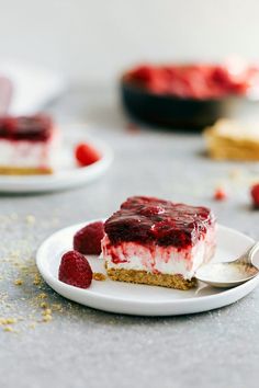 a piece of cheesecake with raspberry topping on a plate