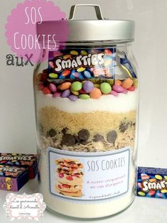 a jar filled with lots of candy and cookies