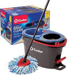 the o - cedar rinse and spin mop is in front of an open box