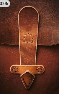 an old brown leather bag with two handles