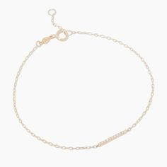 A jewelry collection staple - this timeless 14k gold diamond bar bracelet has a barely-there, adjustable chain that's extra dainty. Product Details 0.066 total carat weight Eleven 1 mm round GH SI1-SI3 diamonds Diamond bar measures 12 mm by 1 mm 14k solid gold 6 3/4" " chain + 1/ 2" extender. Adjustable in 1/2" increments 6 3/4"- 7 1/4" Spring ring closure | Diamond Bar Bracelet in Gold, Women's in 14k gold by Fine Diamond Bar Bracelet, Gorjana Jewelry, Orange Agate, Yellow Opal, Bar Bracelet, Dainty Bracelet, Diamond Bar, Pink Enamel, Bar Bracelets