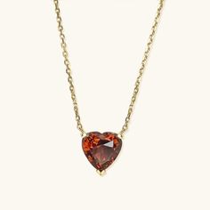 Simple, elegant, and timeless! Presenting our heart-shaped natural garnet necklace handcrafted in 9K solid gold. This style is offered in a choice of other gemstones as well. Can be paired with our Gold Heart Shape Garnet Studs. Ships within 3 business days. - Stone size: 5mm(0.5ct) or 7mm(1ct) - Stone info: natural garnet - Chain length: adjustable 16+2" - Made in 9 karat gold. - Stamp with 9K. Classic Heart-shaped Birthstone Necklace, Formal Heart Cut Birthstone Necklace, Classic Heart Pendant Necklace With Birthstone, Elegant Formal Heart Necklace With Birthstone, Heart Pendant Necklace With Gemstone For Formal Occasions, Formal Heart Shaped Gemstone Necklace, Formal Heart-shaped Gemstone Necklace, Classic Heart Cut Birthstone Necklace, Fine Jewelry Heart Necklace With Birthstone For Formal Occasions