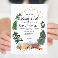 a person holding up a card that says we can baby wait with animals and trees