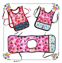 three bibs with flowers and hearts on them, one has a pink flowered design