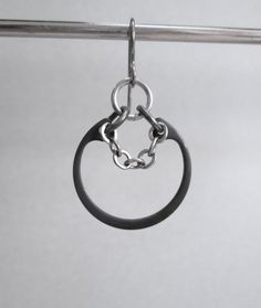 These cool industrial earrings are made from retaining ring hardware, silver toned chain and stainless steel jump rings. The retaining rings range from a dark steel gray color to black depending on the batch. The ear wires are hypoallergenic titanium. They are a little more than 1 1/2 inches (3.8 cm) long from the top of the ear wires, and the rings are just under an inch (2.5 cm) across. I have lots of jump rings if you would like to replace the black and silver with some color. Just request a Everyday Metal Hoop Earrings With Oxidized Finish, Metal Earrings With Hook And Links For Gifts, Edgy Small Hoop Metal Jewelry, Black Metal Earrings, Earrings Industrial, Earrings Edgy, Black Hoop Earrings, Industrial Earrings, Silverware Art