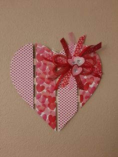 a heart shaped decoration hanging on the wall