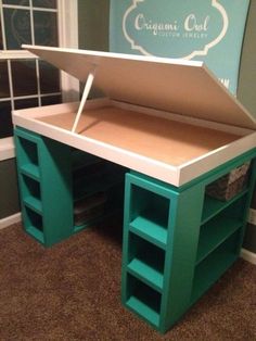 a desk made out of cardboard with drawers