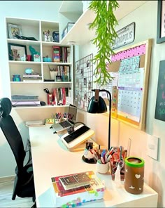 an office with a desk, chair and bookshelf full of stuff on it