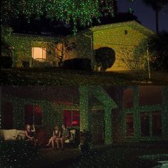 people sitting on a bench in front of a house covered with christmas lights