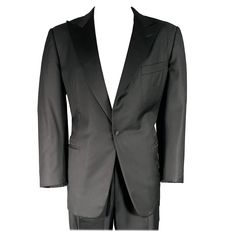 ERMENEGILDO ZEGNA tuxedo in a black wool with a full liner and includes a single breasted, single button sport coat with a peak lapel and matching pleated trousers. Made in Switzerland. Note: sleeves are slightly uneven, please check measurements.Very Good Pre-Owned Condition. Marked: 56 Measurements: -JacketShoulder: 19 inches Chest: 46 inches Left Sleeve: 25 inches Right Sleeve: 25.5 inches Length: 31.5 inches -PantsWaist: 36 inches Rise: 11 inches Inseam: 30 inches Sui Generis Reference: 1298 Black Silk Blazer With Suit Collar, Classic Evening Single-breasted Suit, Tailored Black Silk Tuxedo, Winter Black Tuxedo With Pressed Crease, Black Silk Blazer With Lapel Collar, Black Silk Suits With Lapel Collar, Classic Black Winter Tuxedo, Black Silk Tuxedo Suits, Black Silk Suits For Black-tie Events